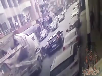 Rider Falls Head First Under Cement Truck