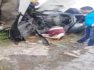 Victims corpse trapped in the wreckage.