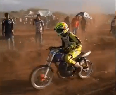 Spectator Filming A Motocross Race Gets A Bike To The Ass