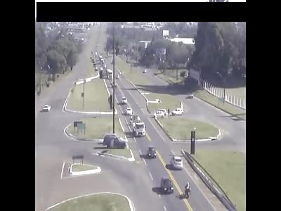 Biker clipped, crashes, then catches fire.