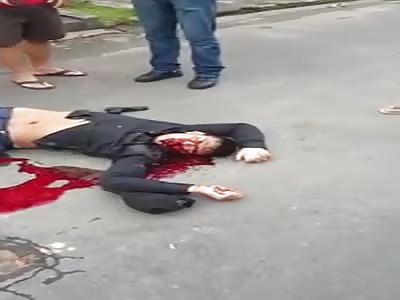 BANDIT AGONIZES ON ASFALT BLEEDING FROM THE MOUTH