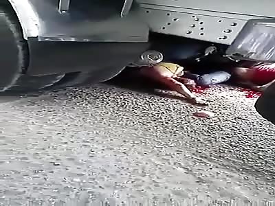 DEAD WOMAN STUCKED UNDER TRUCK TIRES