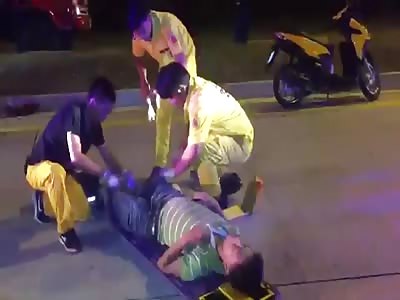 MAN LEGS TRAPPED UNDER VAN