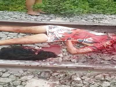 GIRL BEHEADED IN THE RAILROAD TRACK