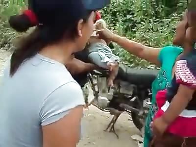 Of a boy put gobos to the wheel of his bicycle and of adult puts babies