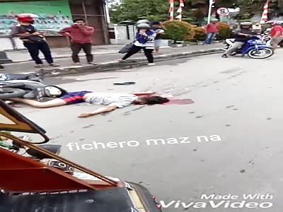 Motorcyclist with head squeezed