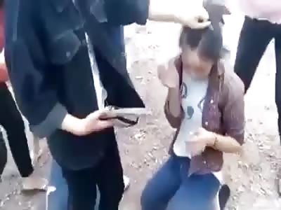 Two women hit in the face with sandals