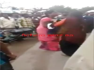 Woman cries for dead son in arms