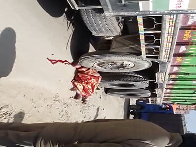 WOMAN DIES CRUSHED OR TRUCK