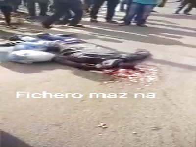 dead man on the street with his head crushed