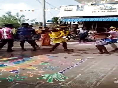 TRUCK PULLS PEOPLE DANCING IN FESTIVAL