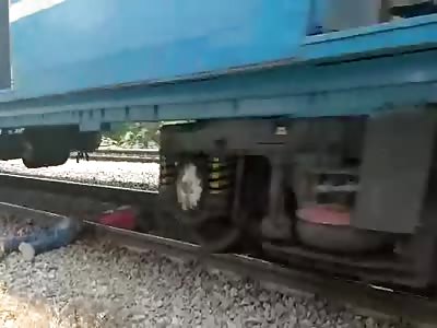 ACCIDENT OR SUICIDE? BODY CUT TO HALF