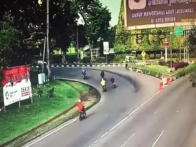 BUS RUNS ABOVE MOTORCYCLIST