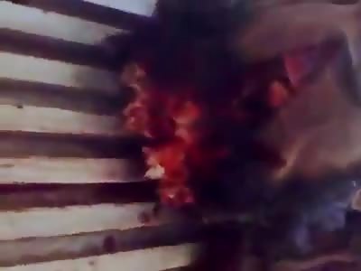 dead man with head and chest wounds