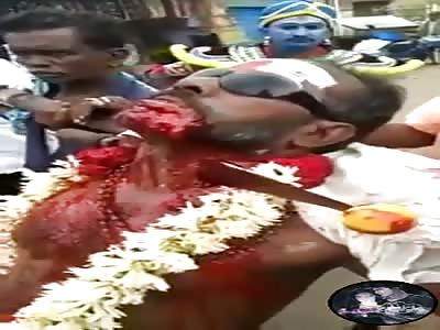 man with knife stucked in neck in ritual