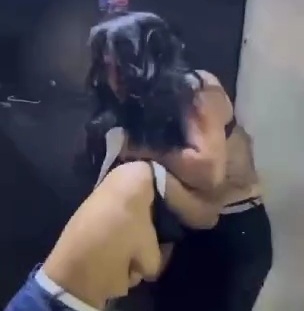 Two Colombian street hookers fighting with some TITS OUT 
