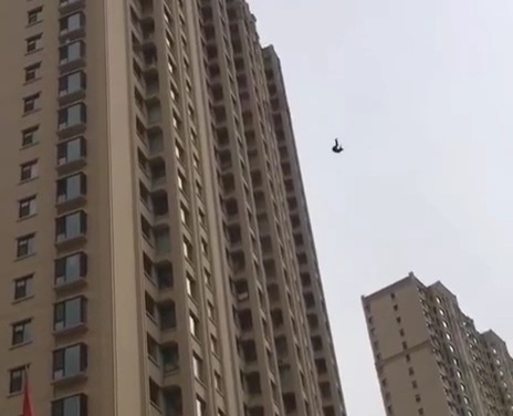 Chinese depressed woman jump from very tall bulding