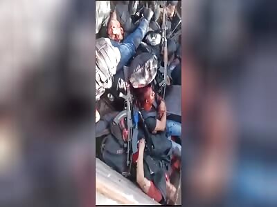 Members of the Sinaloa cartel show the bodies of their dead Chiapas and Guatemala cartel rivals 