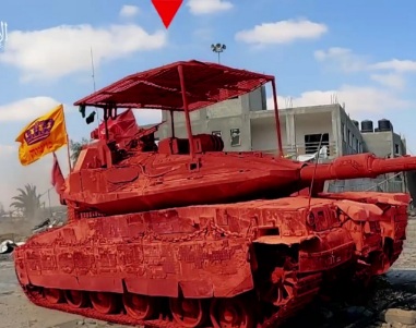 Qassam fighter blowing Israeli tank byplanting explosiv underneath it