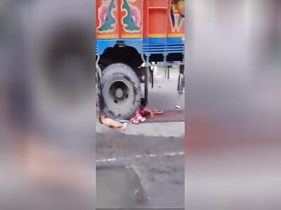 Woman Crushed Under Truck Wheels