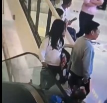 The Girl Sat on the Railing of the Escalator and Died