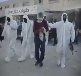 masked Hamas fighters execute old man for stealing humanitarian aid 