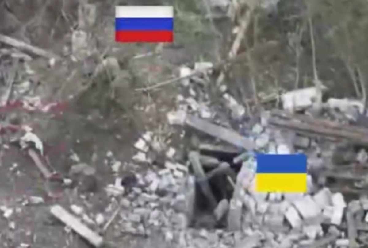 Russian soldier throws an anti-tank mine at a Ukrainian. 