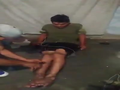 Thief tied up by barbed wire