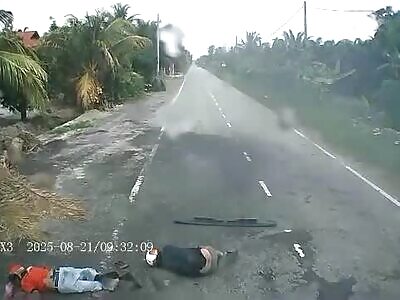 Pair on bike gets a morning greet from the truck 