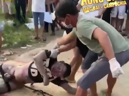 Dead rotten body of a drowned man floating in river 