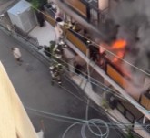 SHE KNOCKS DOWN FIREFIGHTERS AND FALLS DURING RESCUE