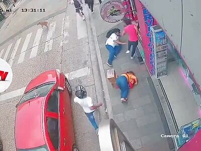 WOMAN DIES, MAN INJURED BY STRAY BULLET IN SHOOTOUT