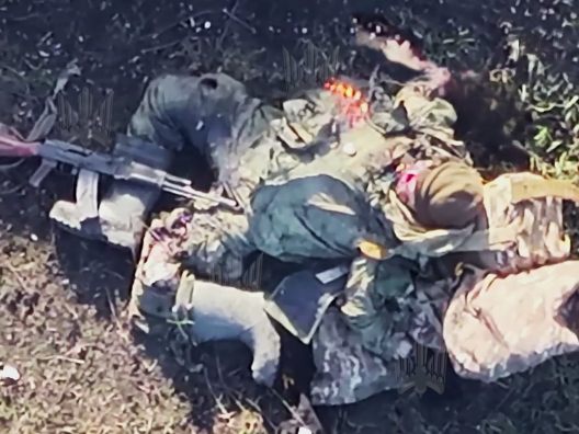 Blasphemy! Russian Untermensch Bends to Human Swastika