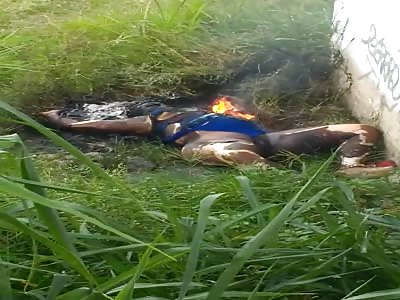 Woman in a corner with body charred very bad horrible