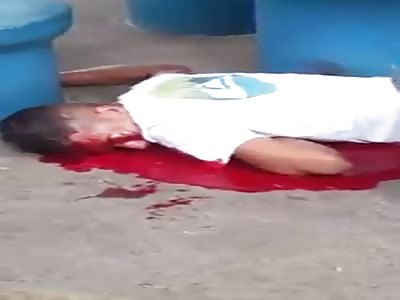 Young man is murdered in public square. agonizing last seconds life