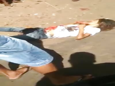 Woman stabbed by her husband agonizes with guts outside