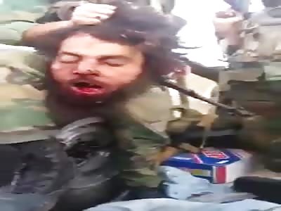 soldiers display enemy's head