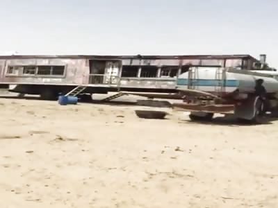 hanging from a water truck