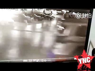  female Chinese officer is crushed into a building by a SUV