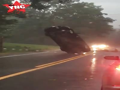 a Car got Stuck Upright on a Road