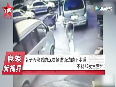  woman explodes  after pouring coal into the sewers on the street 