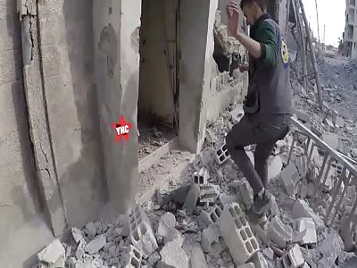 dead  body recovered from the rubble of destroyed buildings