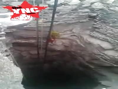 retrieving the body of a woman who was pushed into a hole by her lover