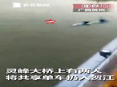 angry bicycle driver on the Lingfeng Bridge in the Babu City district of Hezhou, Guangxi. 