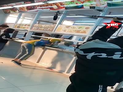 Chinese woman gets her head stuck at the restaurant counter