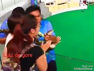 Snake bites face of a woman