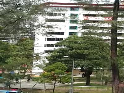 Man jumps off top floor of apartment building.