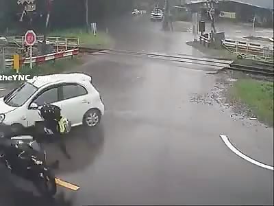 Car Sends Biker Flying 