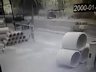 Biker Gets Flattened by a Truck