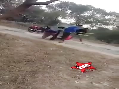 Man is beaten in front of his wife